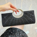 Elegant black beaded evening clutch bag featuring a sparkling rhinestone circular metal handle - Black