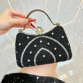 Luxury black evening clutch with sparkling rhinestone waves and pearl handle detail - Black
