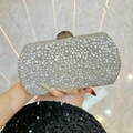 Silver evening clutch bag featuring shimmering crystals and elegant pearl embellishments - Silver