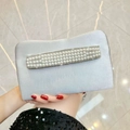 Elegant silver evening clutch bag featuring three rows of pearls and luxury finish - Silver