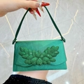 Elegant emerald green satin evening bag with sparkling green rhinestone wing decor - Green