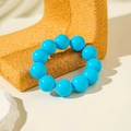 Ethnic style bracelet with large glossy bright blue resin beads on a straw stand - Sky Blue