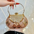 Rose gold luxury evening clutch with rhinestone bow and metallic ring handle - Champagne