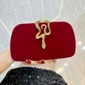 Elegant red velvet evening clutch bag featuring a gold snake clasp with crystals - Burgundy