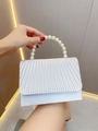 Detail of pleated pearl white evening bag featuring a decorative large pearl handle - Silver