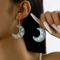 Detailed view of resin crescent moon earrings with colorful sequins and star elements - Light Blue Star Style (27686-Light blue)