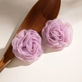 Detailed view of light purple handmade tulle rose earrings on a rustic wooden spoon - Pink Purple
