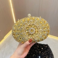 Macro shot of gold floral crystal clutch bag featuring yellow rhinestones and spherical clasp - Gold