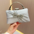 Silver pleated evening clutch bag with sparkling rhinestone bow and metal handle - Silver