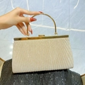 Elegant champagne gold pleated evening clutch bag with metallic ring handle and glitter texture - Apricot