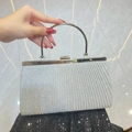 Silver sequin pleated evening clutch bag with round metal handle and sparkling fabric finish - Silver (Silver Hardware)