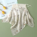 Close-up of floral silk sun protection mask with yellow daisy print and adjustable straps - Off-white - Yellow Daisy