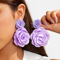 Detail of lavender purple fabric rose earrings with 3D layered petals worn by a model - 3D Large Rose Style (27843-ear-purple-3) / Lavender