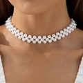 Close-up of double-layered woven white pearl choker necklace on a model's neck - White Double-row Woven Pearl Choker (30826-nek-white-EP)