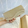 Elegant champagne gold pleated clutch bag with shimmering fabric and rhinestone trim - Gold