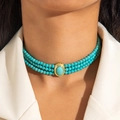 Detail of bohemian three-layer turquoise beaded necklace with oval centerpiece on model - Cyan 3-layer Turquoise Necklace (28257-blue)