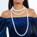 Close-up of three-layer gradient faux pearl necklace set on an elegant model - White 3-layer Pearl Necklace Set (28549-white)