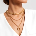 Close-up of layered gold chunky Cuban link necklace with oval pendant on neck - Gold Three Layer Layered Oval Hollow Pendant Necklace(30178-nek-G)