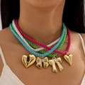 Colorful woven cord necklaces with gold bow and heart pendants worn by a model - 4-Color Braided Cord Pendant Necklace Set (28206-colour)