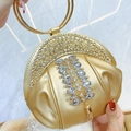Pochette de soirée en cuir doré avec franges en cristal et poignée en anneau métallique - Or