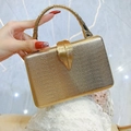 Champagne gold snakeskin clutch bag with metallic leaf clasp and rhinestone handle - Champagne