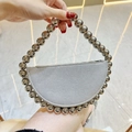 Detail of silver metallic crescent bag with large beaded handle and modern texture - Silver with Silver Beaded Handle