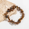 Bracelet en éclats d'œil de tigre naturel avec une finition brun doré polie - Marron