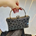 Sparkling rhinestone clutch bag in black and white crystals with golden ring handle - Black