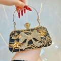 Elegant black glitter evening clutch with gold bow handle and rhinestone accents - Black