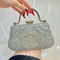 Silver evening clutch with rhinestone floral pattern and yellow gemstone clasp - Silver