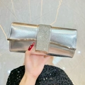 Elegant silver clutch bag with sparkling rhinestone strip and metallic hardware finish - Silver