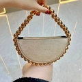 Champagne gold crescent evening bag with beaded handle and shimmering glitter finish - Gold with Gold Beaded Handle