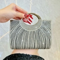Sparkling silver and black rhinestone evening bag with elegant curved stripe patterns - Silver