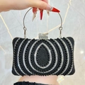 Elegant black pearl evening bag with silver ring handle and sparkling rhinestone details - Black