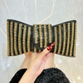 Elegante pochette da sera a forma di fiocco con strass a righe nere e dorate - Nero