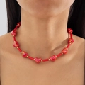 Detail of red acrylic heart beads and golden accents on a geometric choker necklace - Red Tubular Beads Metallic Red Heart Style (28691-red)
