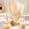 Conjunto de joyas doradas con gemas de colores en collar, pulsera y pendientes - Juego de Gemas Redondas Multicolor (28808-colour)