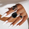 Three-piece ring set featuring geometric black cubes and abstract silver bands on model - Dimensional Cube And Irregular Black Face Style / Silver Black Combination
