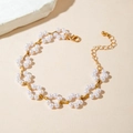 Close-up of a gold pearl floral necklace with intricate flower clusters and lobster clasp - Pearl Flower Cluster Bracelet (25826-bra-G-5-EP)
