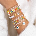 Set da 10 bracciali bohémien con perline colorate, occhio del male e ciondoli a margherita - Set Misto di 10 Pezzi Margherita Malocchio Perla(28733-G)