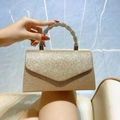 Sparkling champagne gold evening clutch with rhinestone handle and sequin finish - Gold