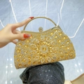 Elegant gold evening clutch bag with sparkling crystals and radial pattern design - Gold