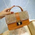 Caramel brown leather handbag with sparkling rhinestone trim and golden oval twist lock - Dark Brown