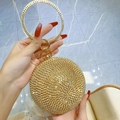 Elegant gold spherical evening clutch bag featuring sparkling rhinestones and metal ring handle - Gold
