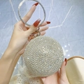Silver round evening clutch bag with sparkling rhinestones and a metal ring handle - Silver