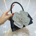 Elegant black evening clutch with large sparkling silver rhinestone flower and top handle - Black
