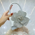 Sparkling silver rhinestone evening bag featuring a large crystal floral embellishment - Silver