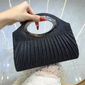 Sparkly black evening clutch bag with pleated detail and silver oval metal handle - Black