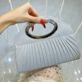 Silver pleated evening clutch bag with round metal handle and sparkling sequin finish - Silver