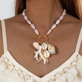 Macro detail of Bohemian shell and starfish pendant necklace with pearls on model - Gold Bohemian Artificial Pearl Shell Necklace (29184-G)